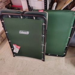 Two Coleman Cots With Pads, Never Used