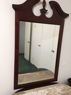 A long solid wood vintage mirror