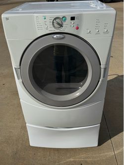 Front load whirlpool dryer electric with pedestal works excellent. Extra for delivery same day delivery and installation available
