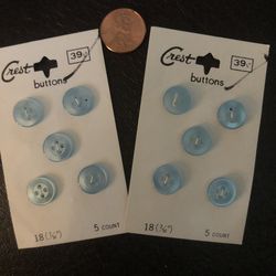 Lot of ten baby blue Crest buttons on card