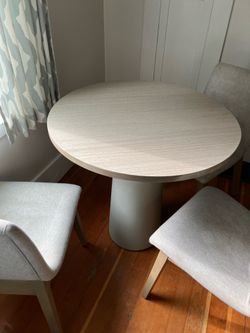 Neutral dining table w/3 upholstered chairs