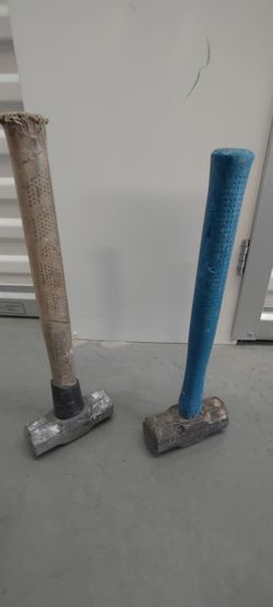 Two Sledgehammers with Worn Handles