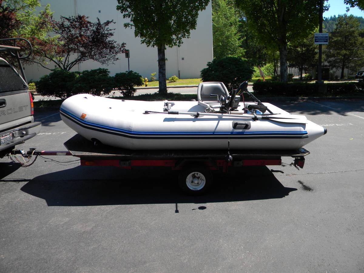 Zodiac inflatable “Zoom” 11’ boat with trailer & accessories