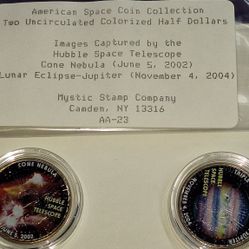 American Space Coin Collection featuring two uncirculated, colorized Kennedy half dollars. 
Coins Included: The set contains coins themed around the "