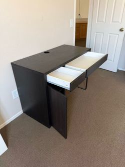 Used writing desk for sale — good condition! Perfect for home office, study setup, or bedroom. Clean and sturdy with normal minor wear.
