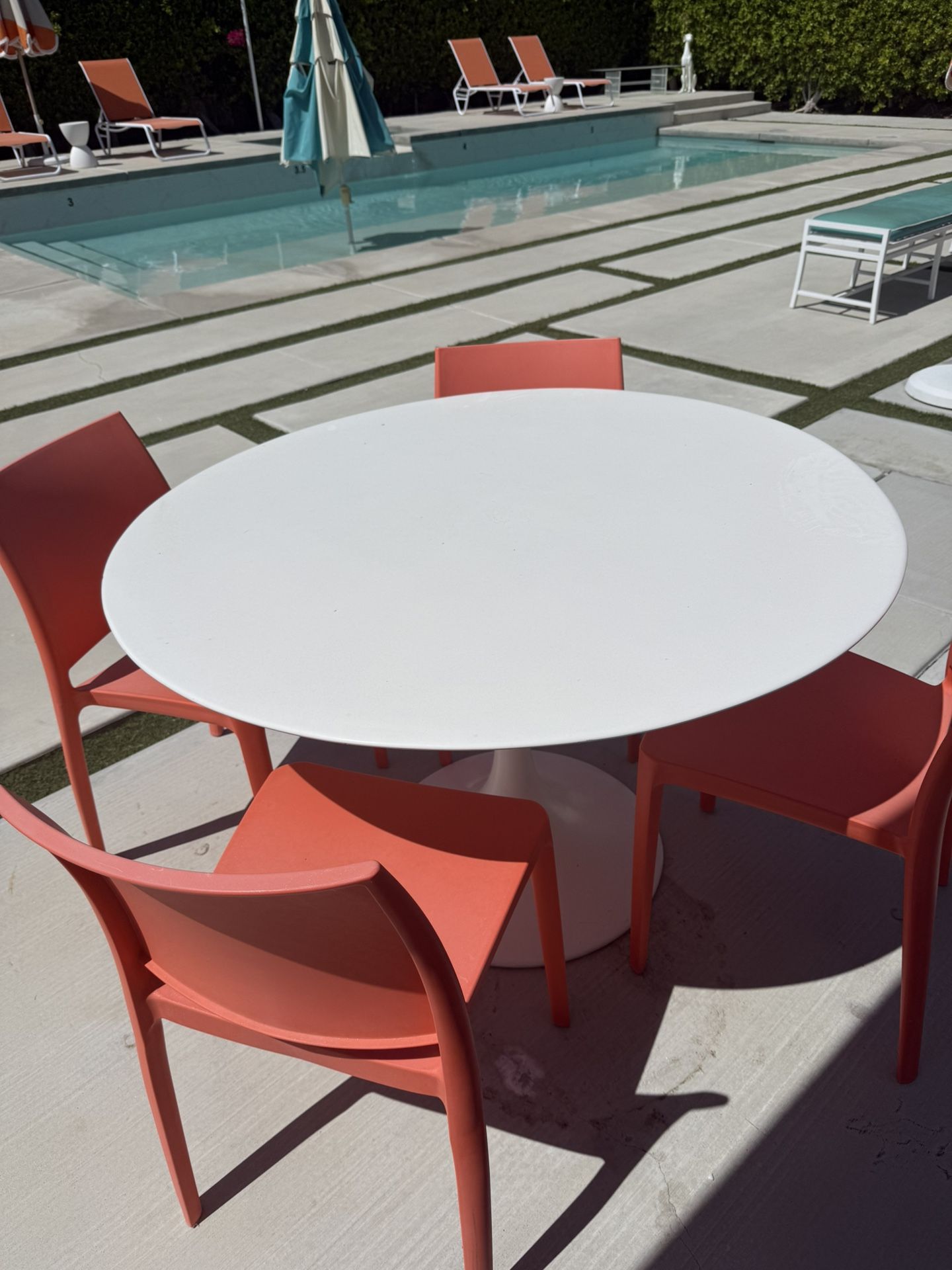Outdoor White Table And Orange Chairs