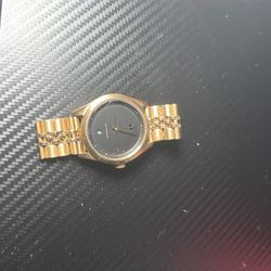 Gold Nixon watch