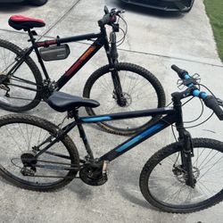Two Northpoint mountain bikes, 2 helmets, and 2 fanny packs