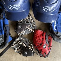 Couple Sets Of Kids Baseball Gear.