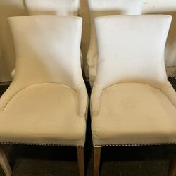 Set Of 4 Cream Wingback Dining Chairs W/Minor Stains(See & Click On Pictures). Still In Good Condition And Useable 
