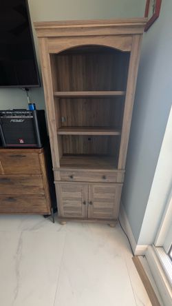 Cabinet with shelves and drawer.