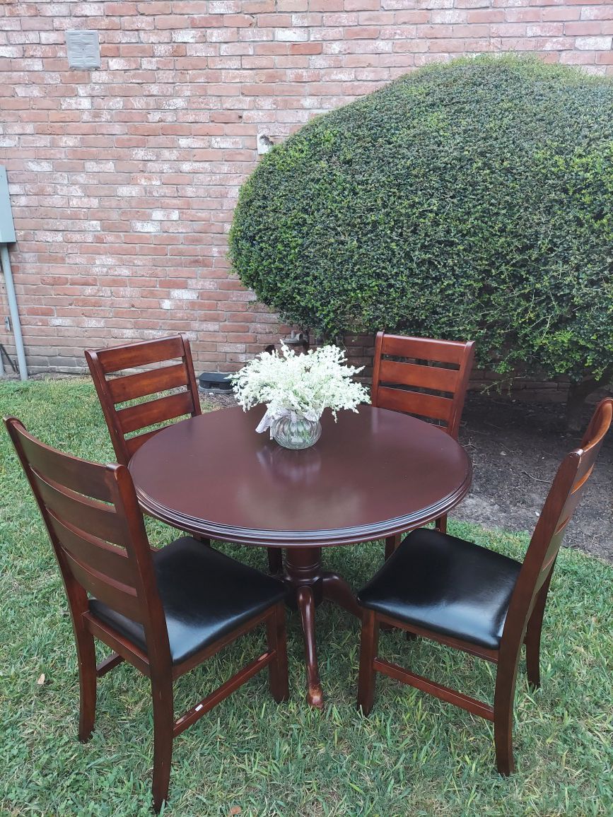 wooden table with 4 chairs high 30 round table 42 good condition