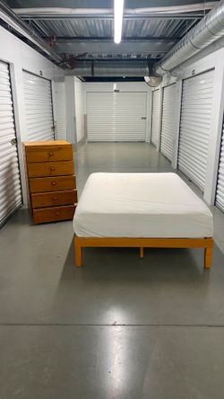 Full size bed frame with mattress and dresser