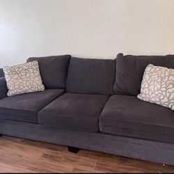 Charcoal loveseat and Two 3-seat Couches