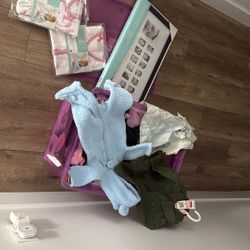 box full of new baby and toddler clothes