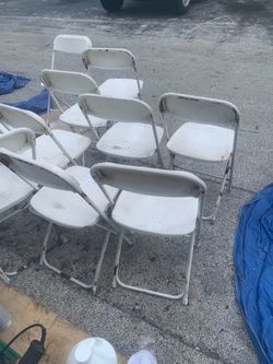 Used white folding chairs s,a,l,e