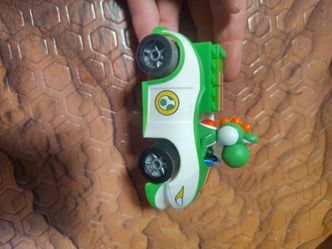 Green Yoshi figure in the driver seat
