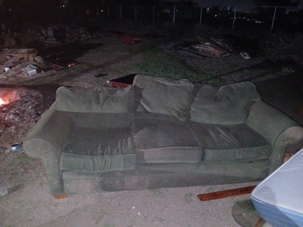 gray couch with  cushions.