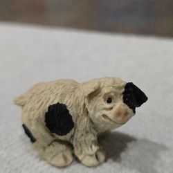 Miniature vintage Stone Critters spotted pig figurine.