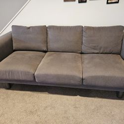 Clean and well kept Grey Fabric Couch