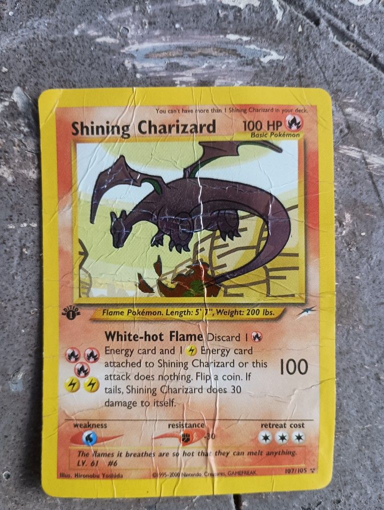Damaged Shining Charizard 1st Edition