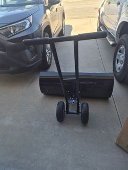 Snow shovel pusher