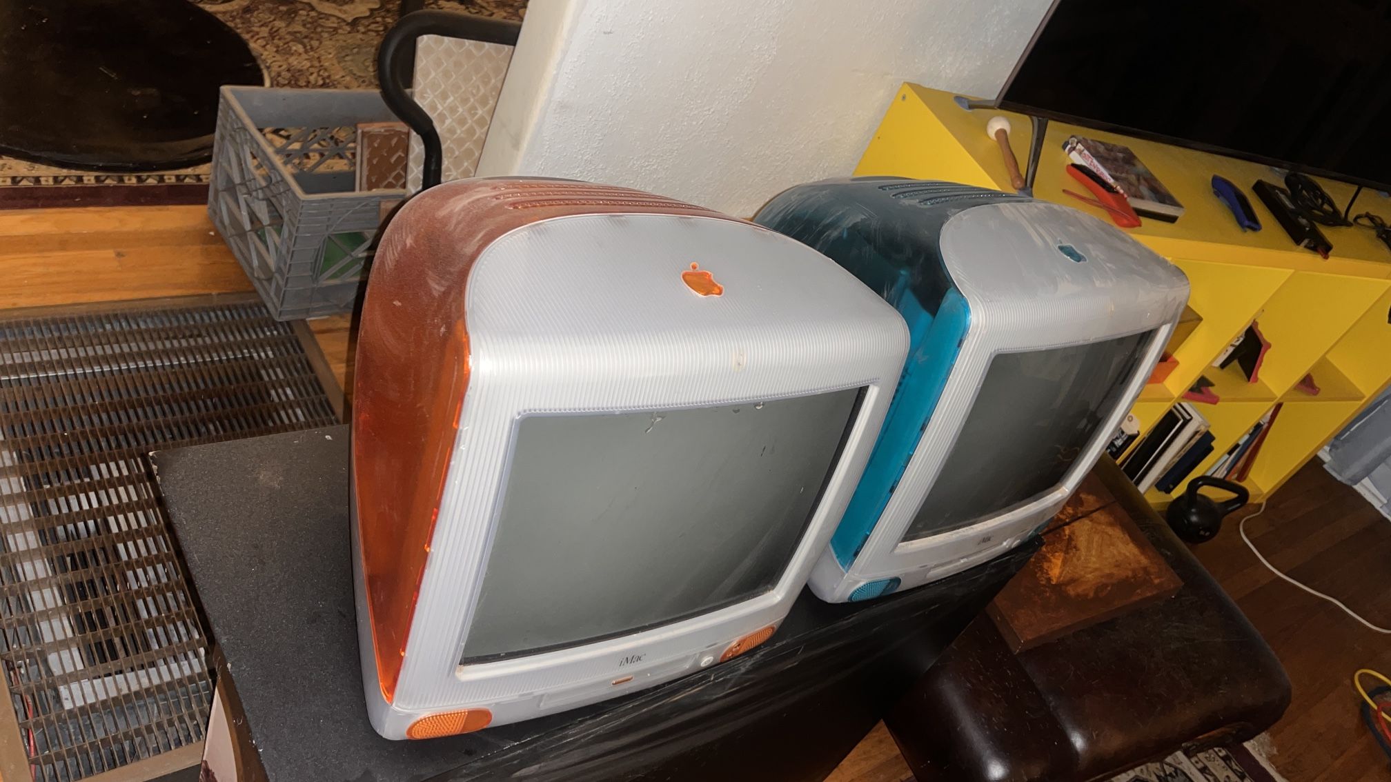 iMac orange and blue with keyboards