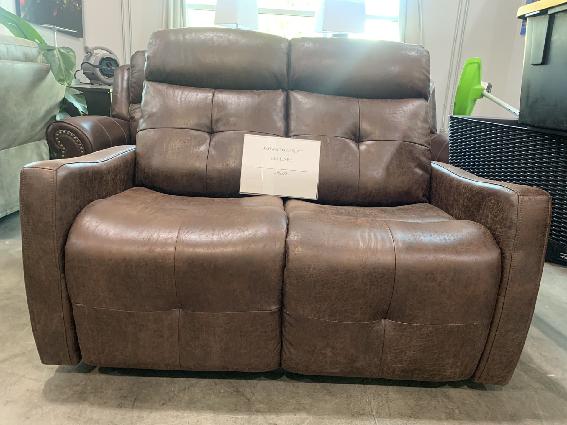 Brown loveseat recliner