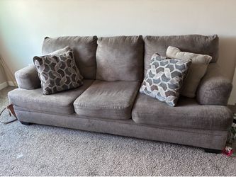 Gray fabric 3 seater couch and a love seat