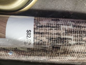 New southwestern neutral 5 by 7 area rug  still in plastic (2) $35 each
