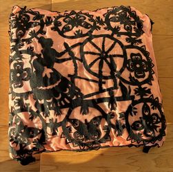 Pillow, hand appliquéd, decorative with lady at spinning wheel, pink satin.
