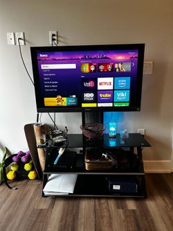 Sony TV with Roku, stand in glass