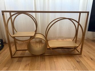 Modern gold geometric metal wall shelf in excellent condition.