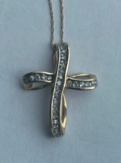 1/8 CT. T.W. Diamond Loop Cross Pendant in 10K Gold