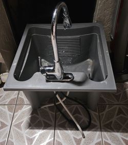 Gray plastic laundry sink. Pull-out spray faucet included. Base/stand legs are NOT included.
Good for garden, patio cleaning. 24x24x15
