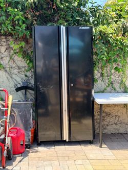 Two husky black storage metal with three shelves
