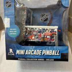 Awesome NHL Mini Arcade Pinball machine. Still sealed in box. Has music and lightbox feature. Cool design with lots of different NHL team logos. Great