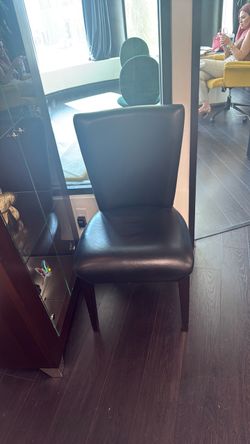 2 black leather chairs