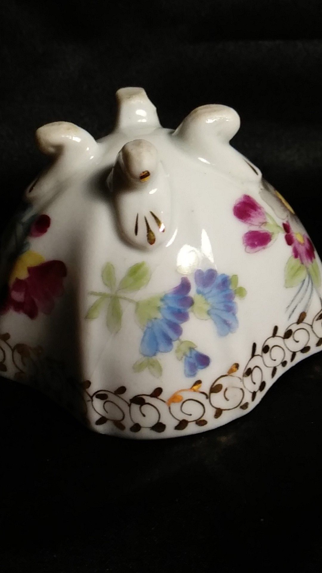 Miniature Porcelain Tea Cup. Four Footed Hand Painted Gold Trim