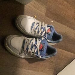 Nike Full Force Low shoes in a white and blue colorway. 