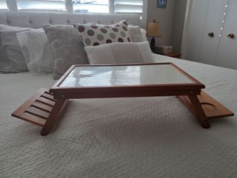 Folding bed table with cup holder