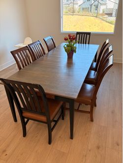 Large wooden table and 8 chairs