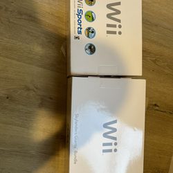 White Wii Console And Blue Wii Console 