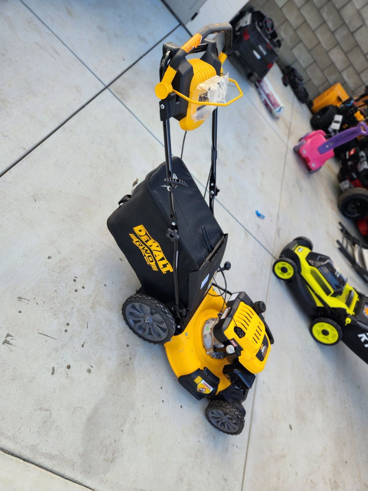 DEWALT 21 in. 196cc E GOV Engine 3 in 1 Gas RWD Self Propelled Lawn Mower with High Rear Wheels Questions & Answers (57