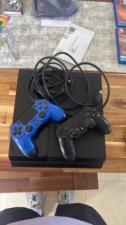 Sony PlayStation 4 Console with Two Controllers