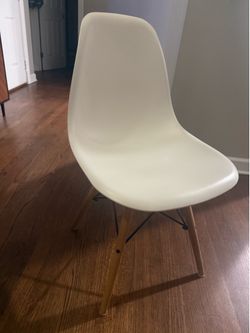 Four white dining room chairs