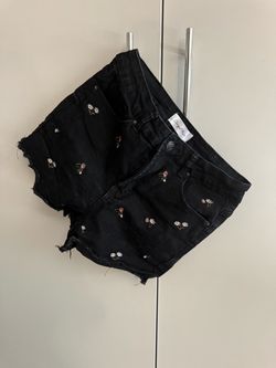 Women’s black flowered jean shorts