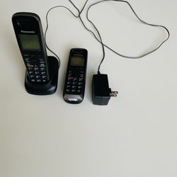 2 Panasonic KX-TGA653 Wireless Telephone Handsets; Panasonic PNLC1010 YA Cordless Phone Expansion Handset Charger Cradle; and Panasonic PQLV219 AC Ada