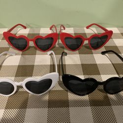 Set Of 4 Plastic Sunglasses , Heart Shaped Lenses, Frame In Different Colors & Thank You Saying On The Side. 