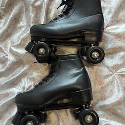 Black leather high top roller skates